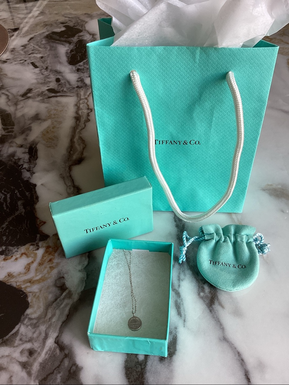 Tiffany & co please return to Tiffany & co New York pendant